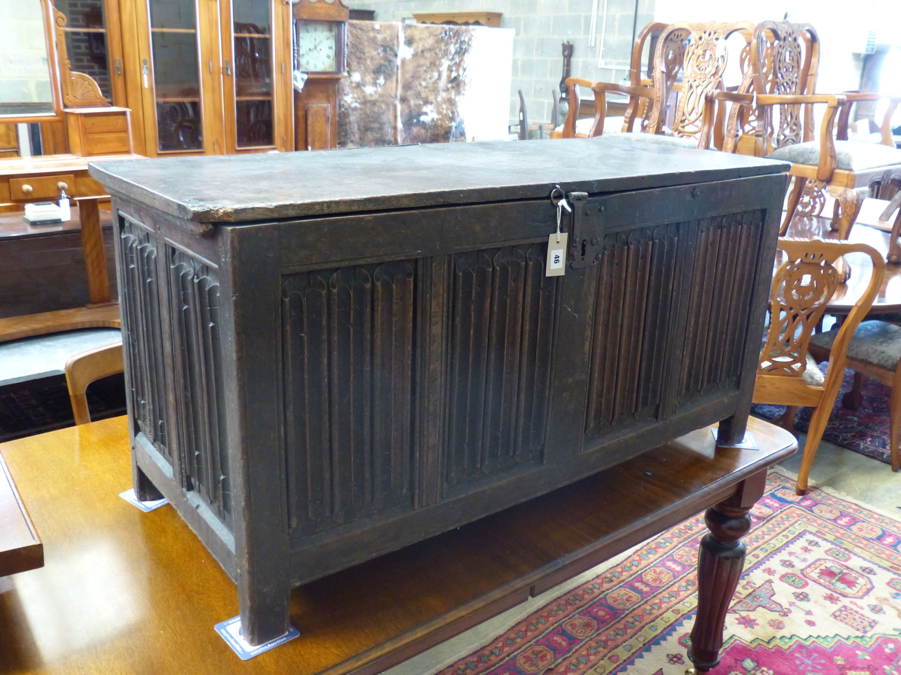 A carved and panelled oak chest, length 129cm, depth 51cm, height 63cm